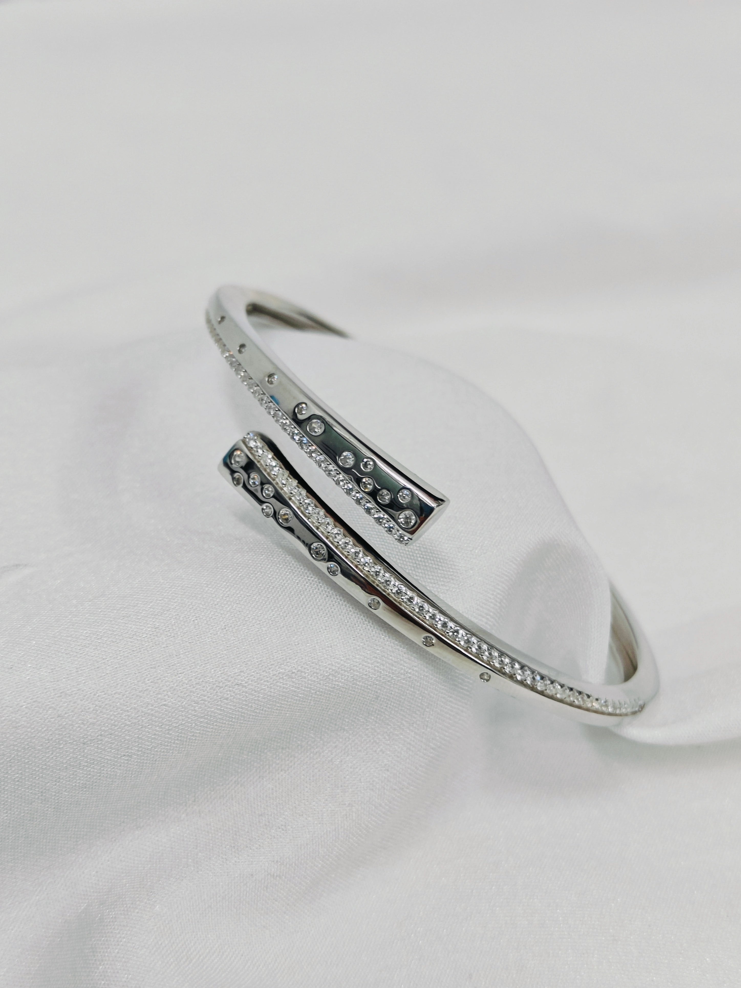 Silver bracelet with gemstones on a white background